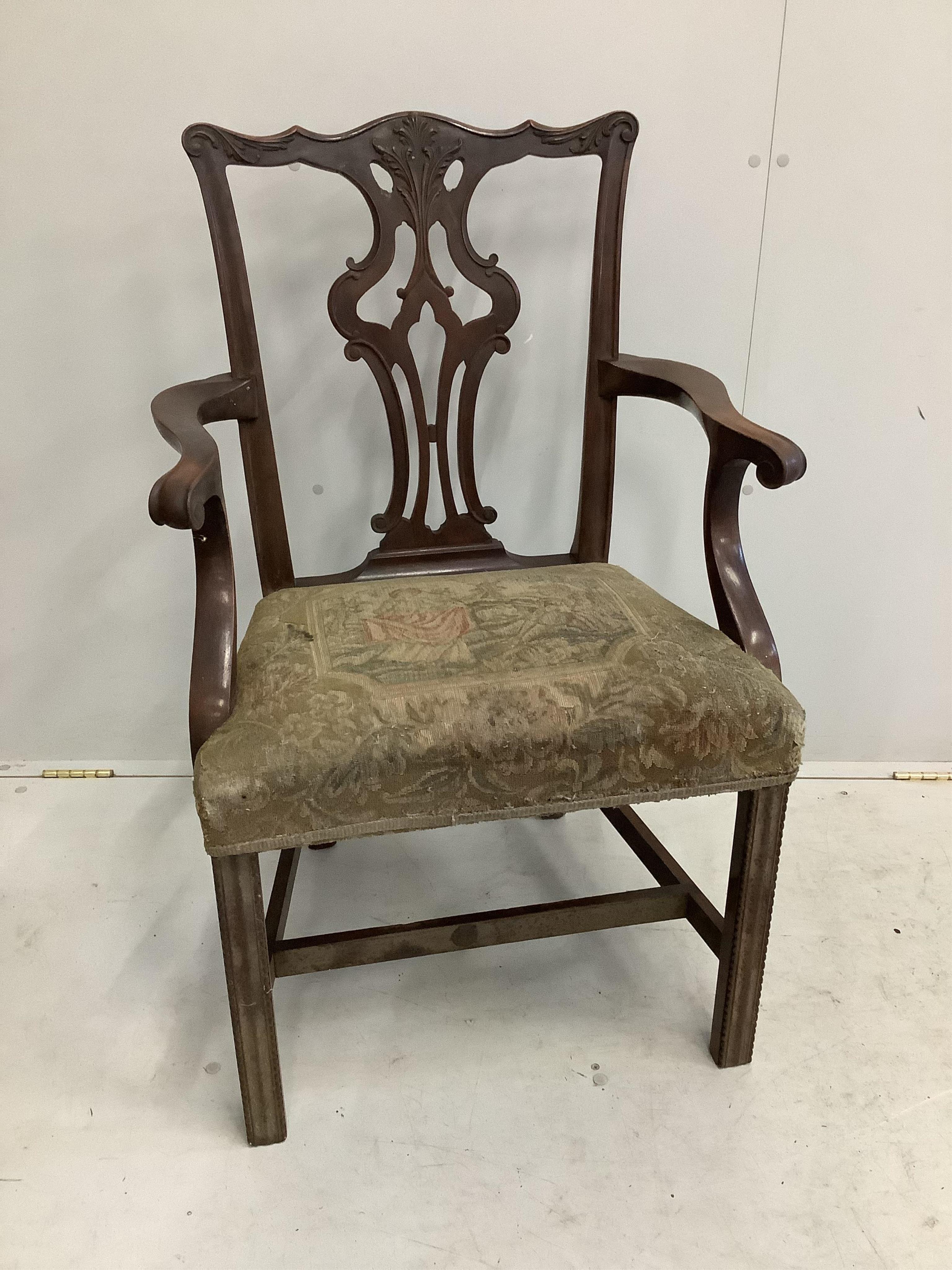 A Chippendale Revival mahogany dining suite comprising extending dining table, 210cm extended, two spare leaves, depth 106cm, height 75cm, bowfront sideboard and serving table, together with six dining chairs (two with a